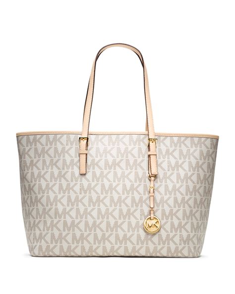 michael kors jet set logo medium travel tote vanilla|Michael Kors airplane print.